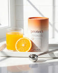 Pura Collagen Protect supplement bottle with label, featuring a sleek design and health benefits on the packaging.