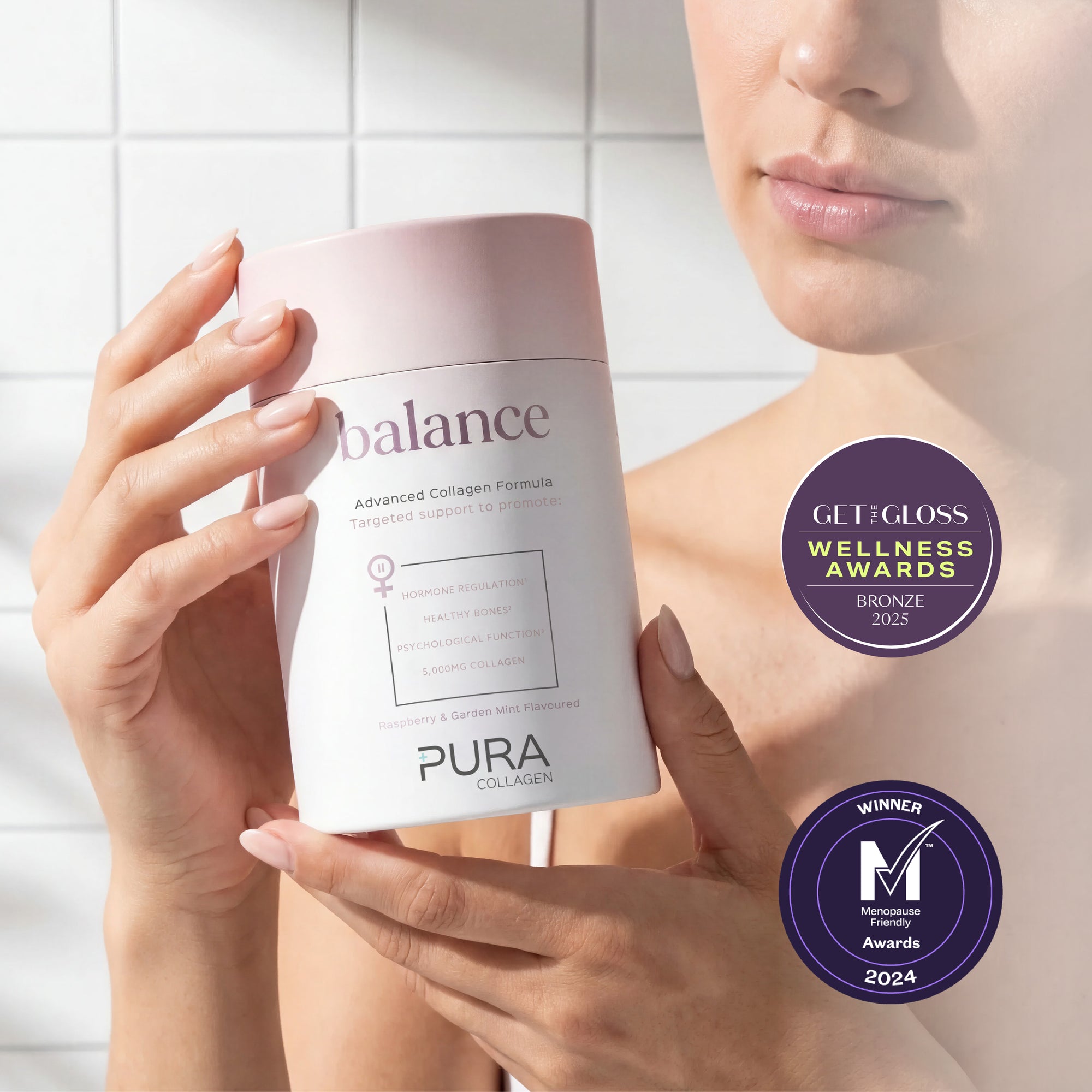 Pura Collagen Balance supplement bottle with a clean label and a glass of water on a wooden surface, emphasizing health and wellness.