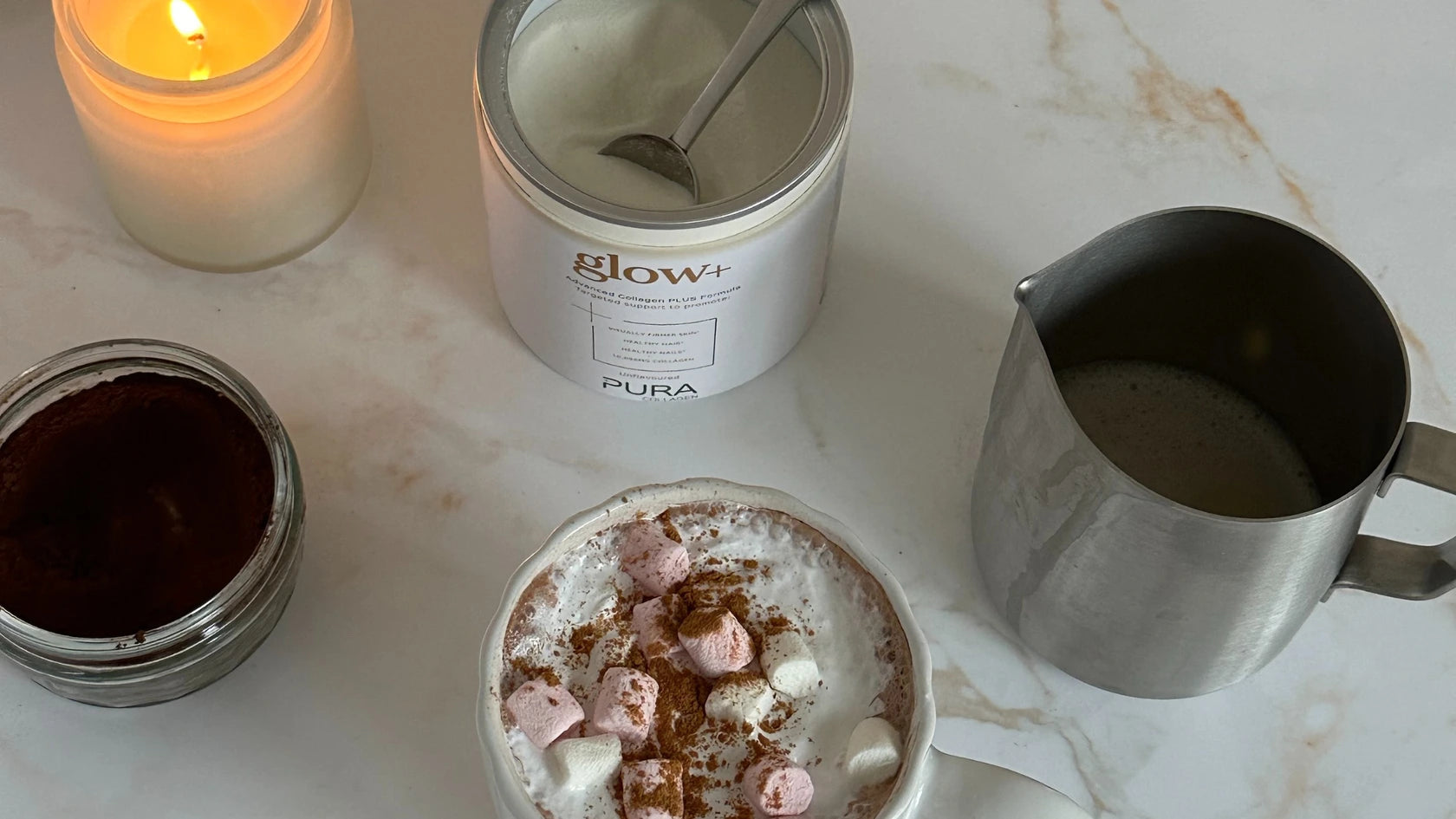 pura glow collagen next to hot chocolate with marshmallows